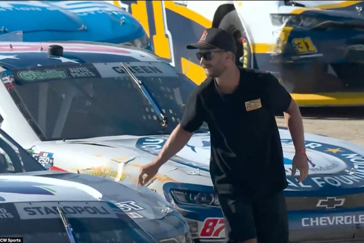 Fan arrested after scaling fences onto NASCAR track, fist-bumping driver during stoppage Fan arrested after scaling fences onto NASCAR track, fist-bumping driver during stoppage