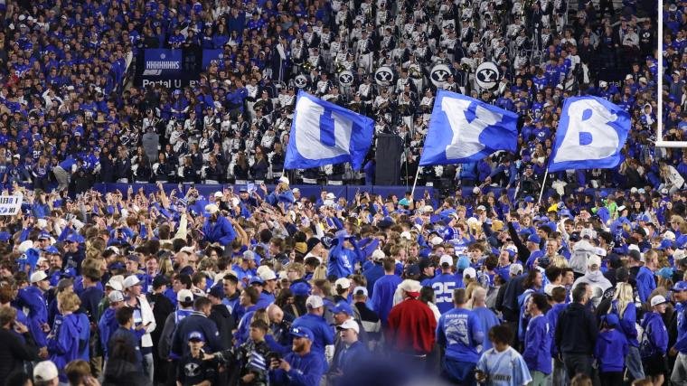 BYU president crowd-surfed when fans rushed the field after a Holy War victory