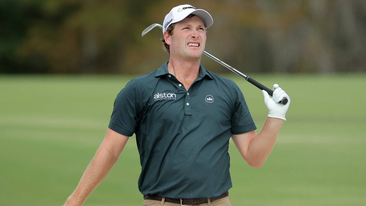 PGA Tour player hits shot from water with gator floating just yards away